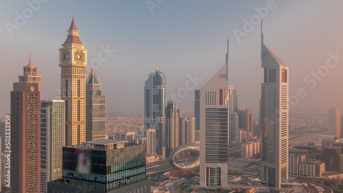 Skyscrapers on Sheikh Zayed Road and DIFC morning timelapse in Dubai, UAE. © neiezhmakov