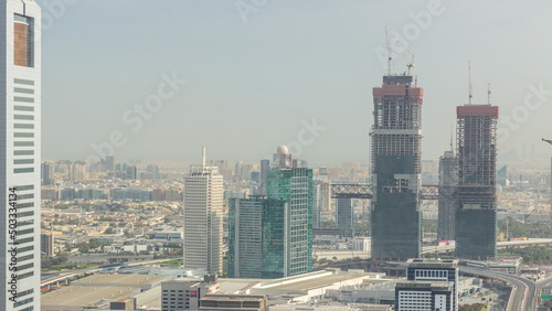 Aerial view of skyscrapers with World Trade center in Dubai timelapse.