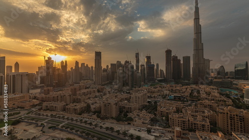 Sunset over Dubai Downtown timelapse with tallest skyscraper and other towers