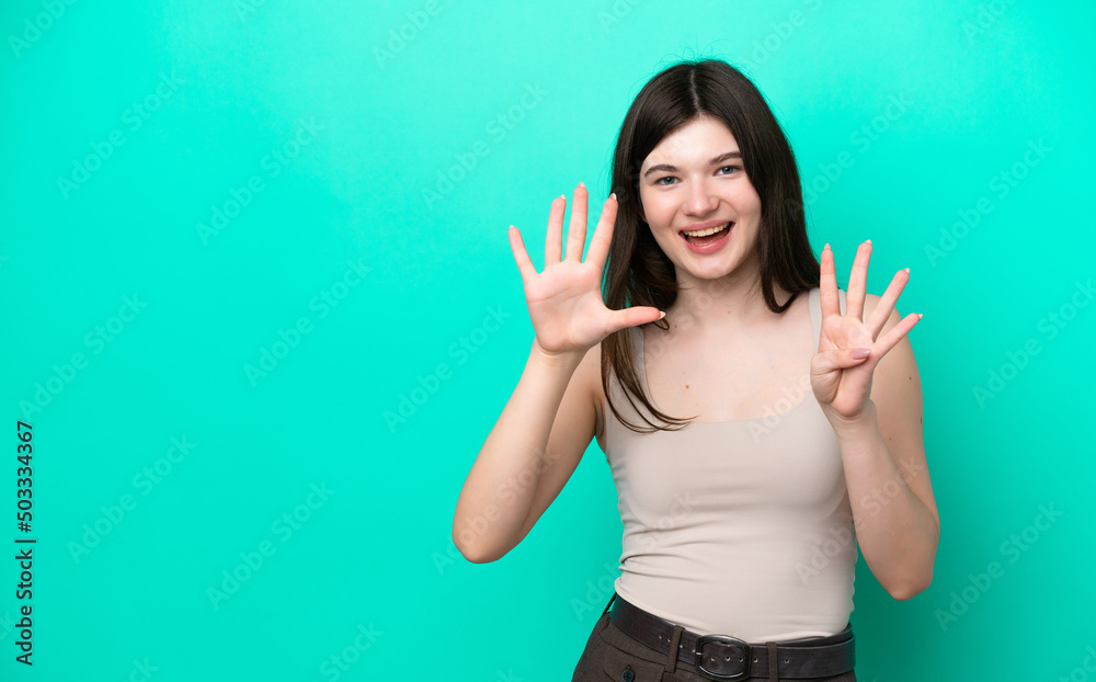 Fototapeta premium Young Russian woman isolated on green background counting nine with fingers