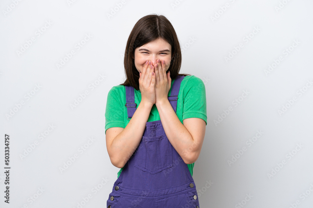 Young Russian woman isolated on blue background happy and smiling covering mouth with hands Young Russian woman isolated on blue background happy and smiling covering mouth with hands