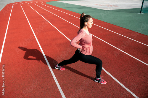 Pregnancy running. Prenatal healthy fitness active fit gym outside. Pregnant woman training yoga sport exercise. Pregnancy exercise. © Maksym