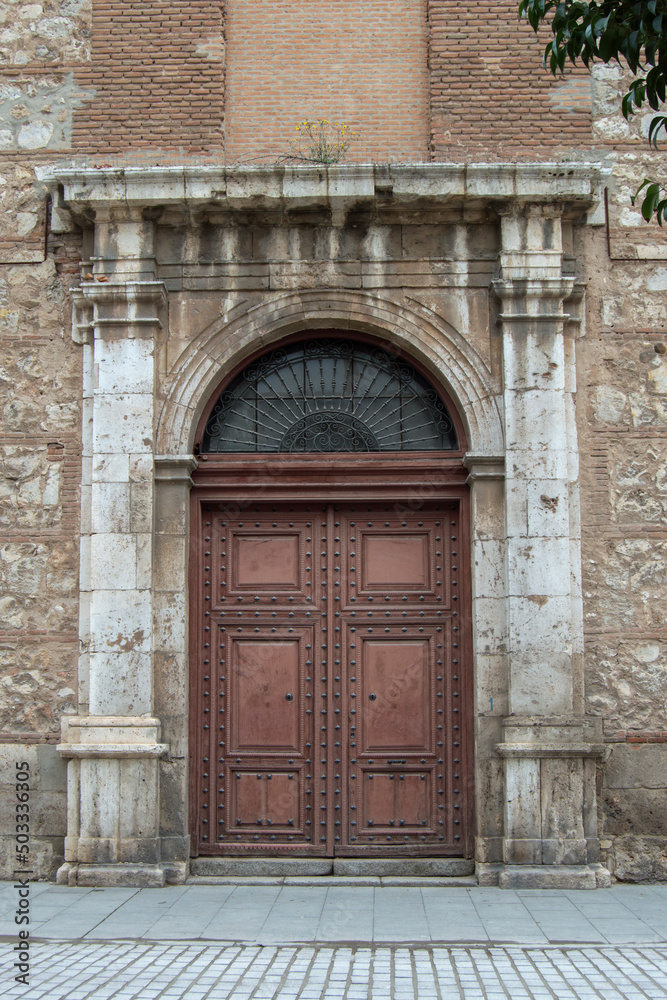 neoclassical style door in a building in Alcalá de Henares, province of Madrid. Spain neoclassical style door in a building in Alcalá de Henares, province of Madrid. Spain