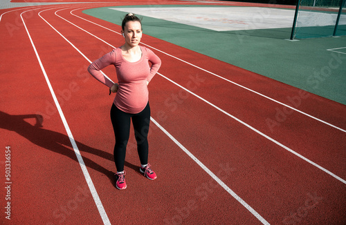 Pregnancy running. Prenatal healthy fitness active fit gym outside. Pregnant woman training yoga sport exercise. Pregnancy exercise.