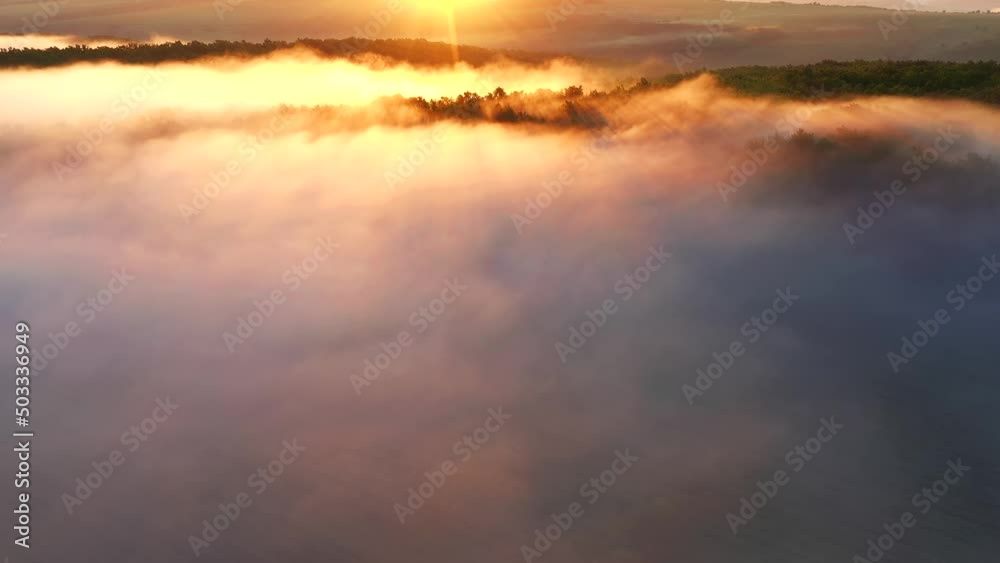 Thick fog moves between hills and forests. Filmed in UHD 4k video. Thick fog moves between hills and forests. Filmed in UHD 4k video.