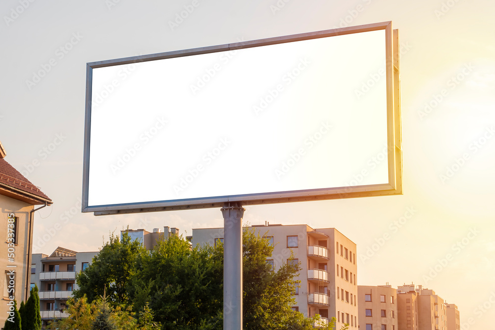 Fototapeta premium Advertising billboard mock-up in the city on a sunny summer day