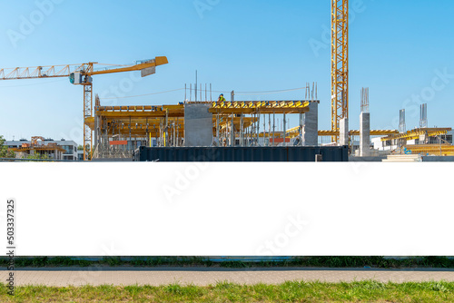 Advertising banner mock-up on the construction site fence photo