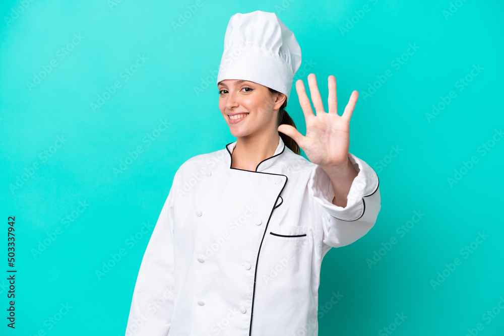 Young caucasian chef woman isolated on blue background counting five with fingers Young caucasian chef woman isolated on blue background counting five with fingers