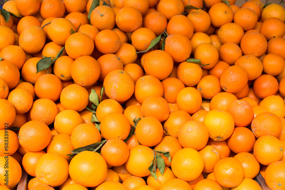Oranges on sale at the local market. Oranges background Oranges on sale at the local market. Oranges background