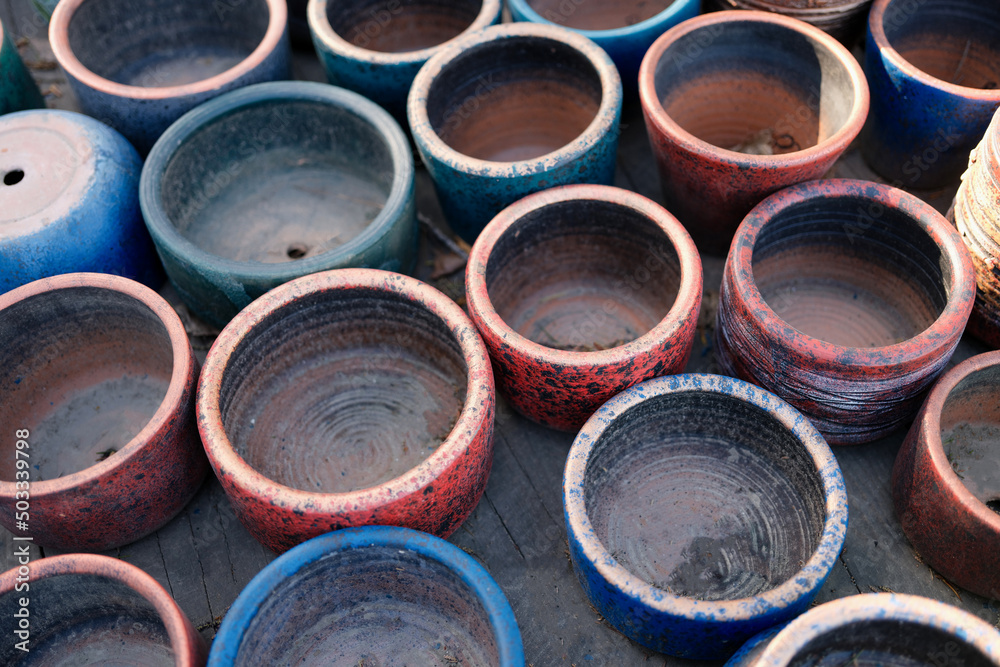 Old clay pots flowerpots closeup. Various used ceramic and clay pots Old clay pots flowerpots closeup. Various used ceramic and clay pots