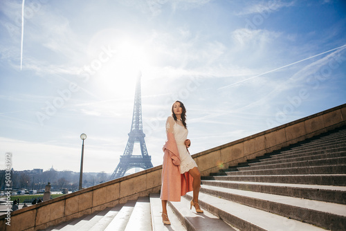 Beautiful girl on background of the Eiffel tower