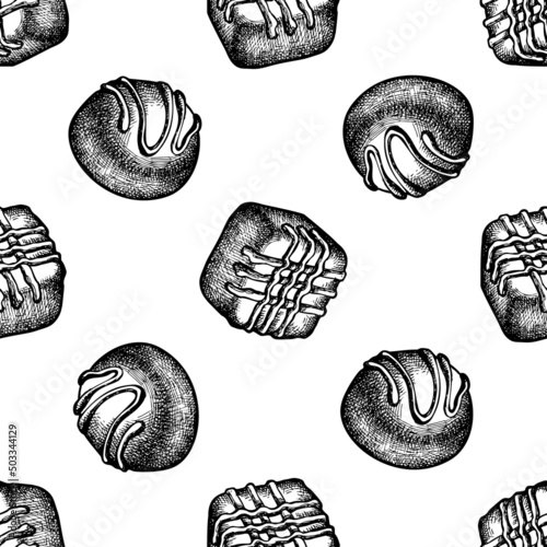 Seamless pattern with black and white chocolate candies