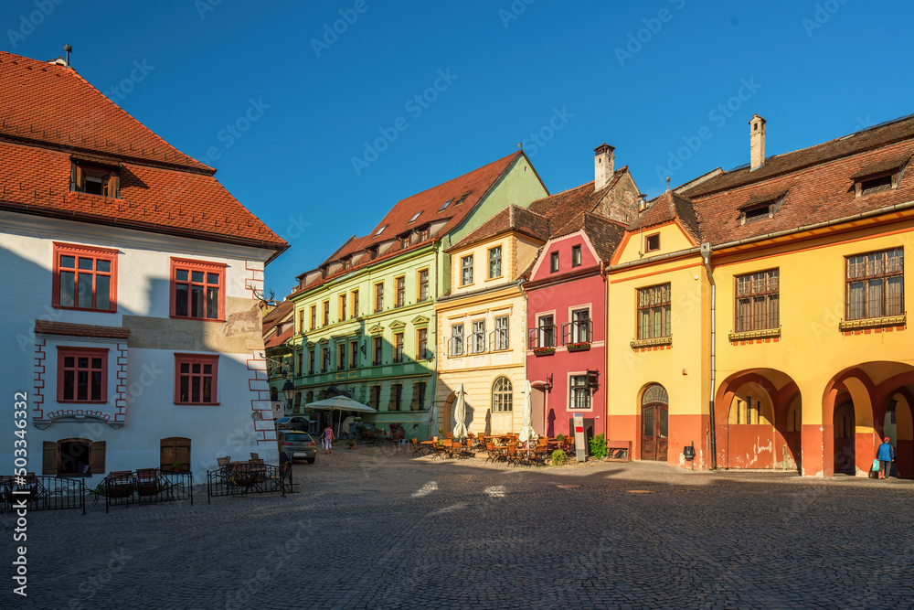 Colorful houses at Citadel Square in historic centre of Sighisoara town, Transylvania region, Romania