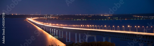 Panorama of The Bridge in night time with illumination. The Presidential Bridge in Ulyanovsk, Russia