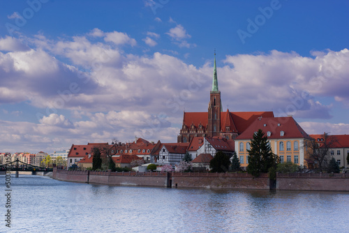 Poland, Wroclaw, April 16, 2022. View to Odra River and Tumski Island. Old Town of Wroclaw in Spring 2022