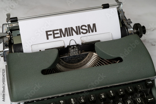 Canvas Print Feminism written on a paper in a type writer