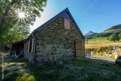 Authentic renovated Pyrenean barn in the Aure valley. slate roof, exposed stone and wood construction. amazing view on the mountains