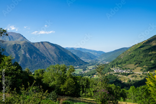 view of valley Aure in the french pyrenees mountains on a cloudy day with typical pyrenean village in altitude photo