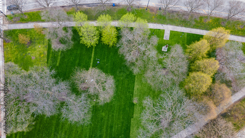 aerial drone view of a local outdoor park in Chicago during overcast. the beautiful environment is lush green ideal for travel and scenery