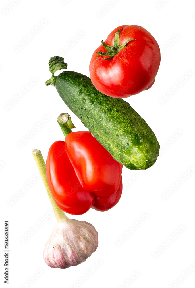 garlic, tomato, cucumber, pepper fly on a white background, close-up garlic, tomato, cucumber, pepper fly on a white background, close-up