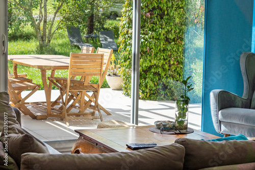 View from the living room onto the terrace, through the bay window, on a beautiful sunny spring day