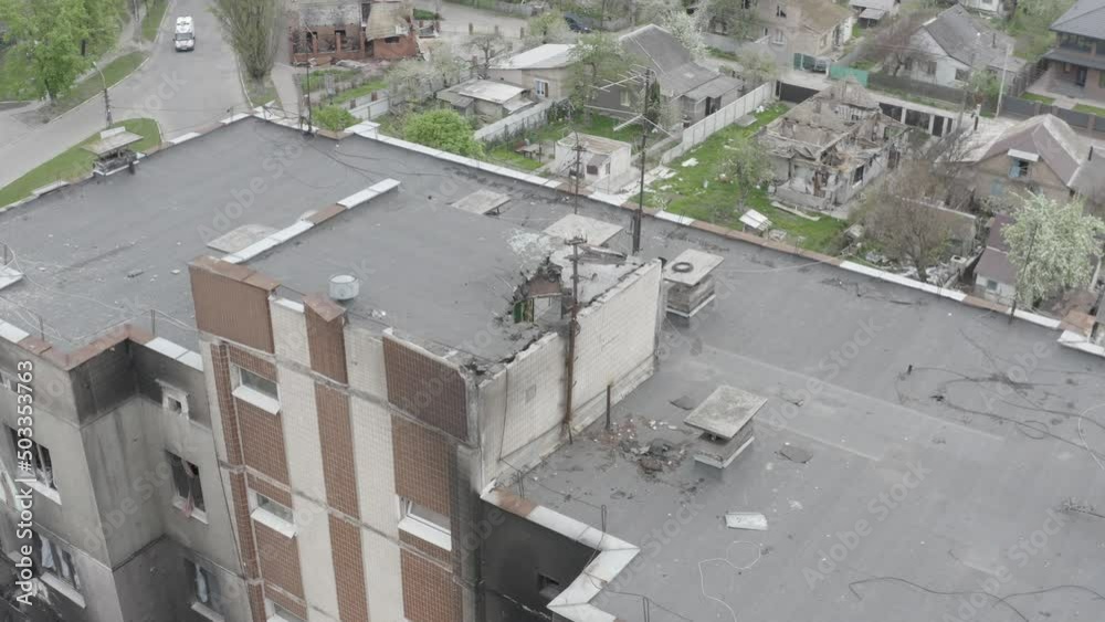 Damaged residential building in the Bucha city, Kyiv region during the fighting after the Russian attack on Ukraine. Russian-Ukrainian war. Aerial. Fire in the house. Damaged residential building in the Bucha city, Kyiv region during the fighting after the Russian attack on Ukraine. Russian-Ukrainian war. Aerial. Fire in the house.