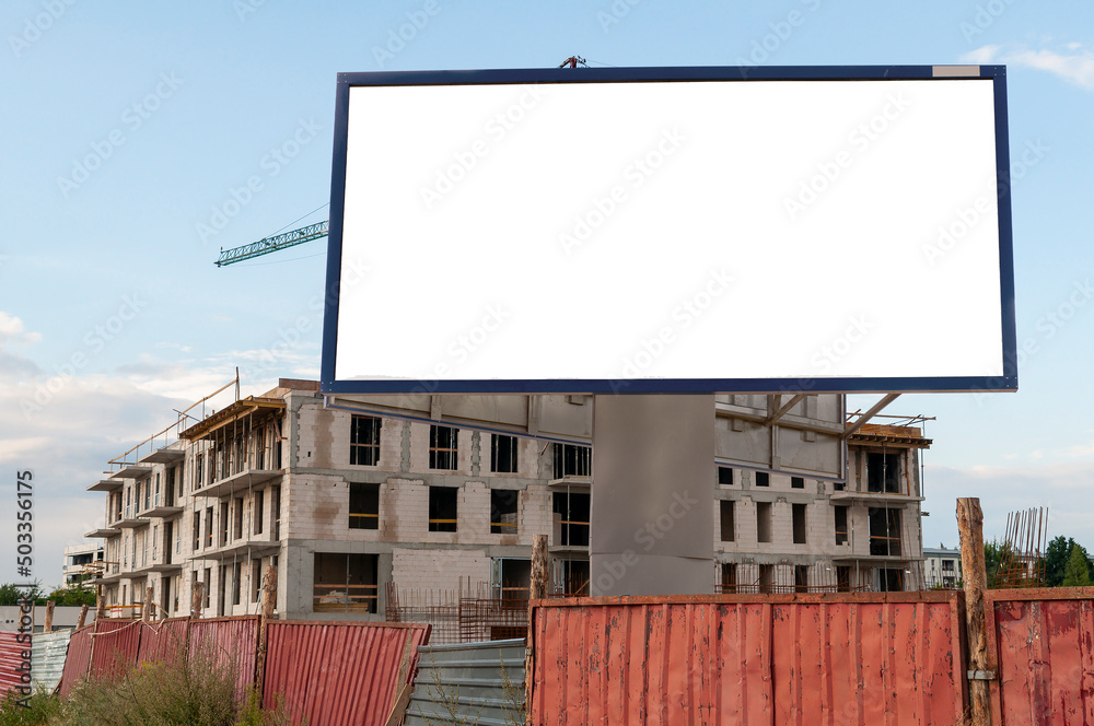 Blank white advertising billboard on the construction site Blank white advertising billboard on the construction site