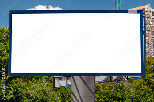 Wallpaper Mural Blank white billboard for advertisement near construction site of modern apartement building among trees Torontodigital.ca