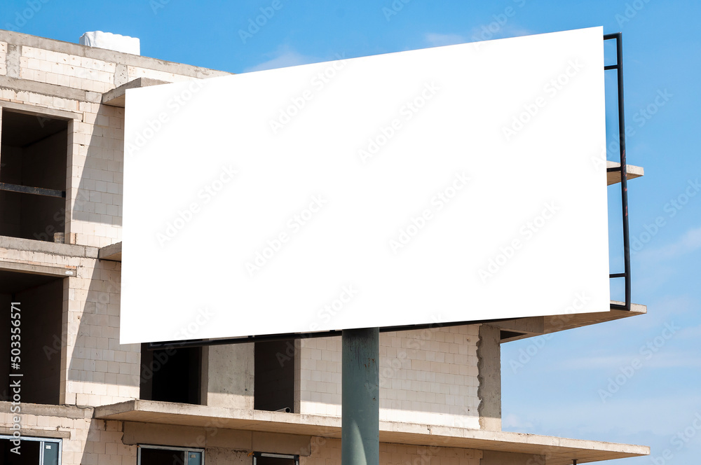 Blank white advertising billboard on the construction site Blank white advertising billboard on the construction site