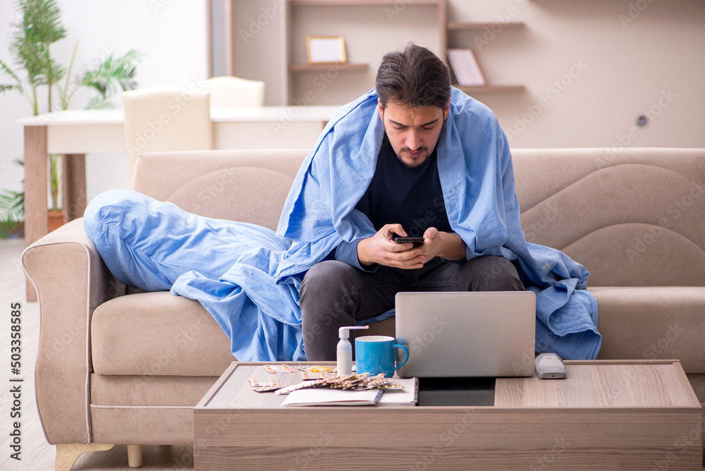 Young man feeling bad at home Young man feeling bad at home