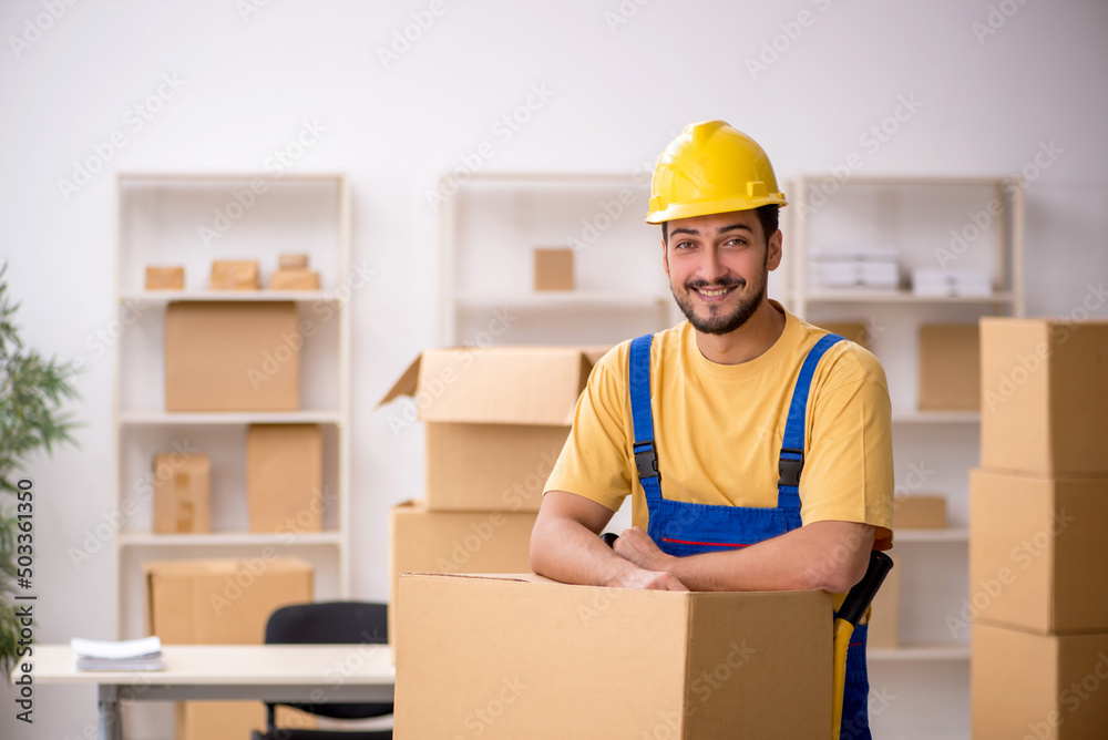 Young male contractor doing home relocation Young male contractor doing home relocation