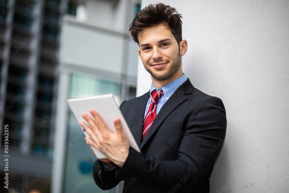 Young manager using a digital tablet outdoor Young manager using a digital tablet outdoor