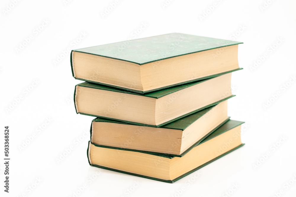 Reading and education. Books stack with green covers on a white background.Reading of books. Knowledge concept.Literature and reading concept. Reading and education. Books stack with green covers on a white background.Reading of books. Knowledge concept.Literature and reading concept.