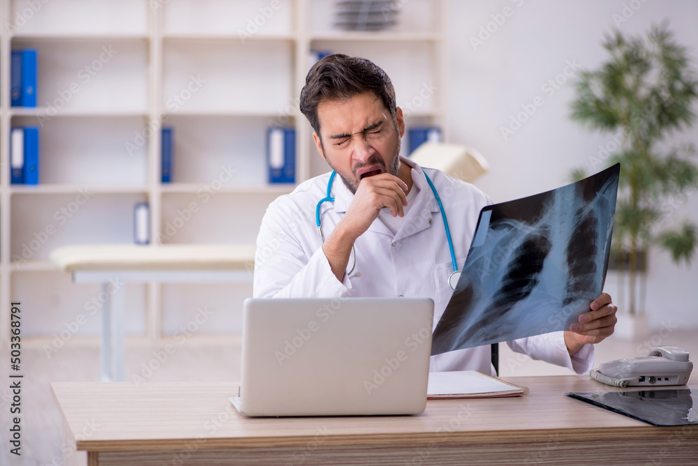 Young male doctor radiologist working in the clinic Young male doctor radiologist working in the clinic