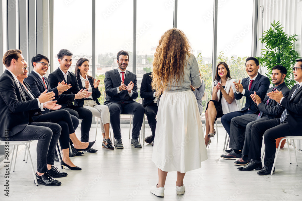 Fototapeta premium Businesswoman coach speaker presentation and discussing meeting strategy sharing idea.Creative team business people seminar and brainstorm in conference seminar at hall.presentation and teamwork