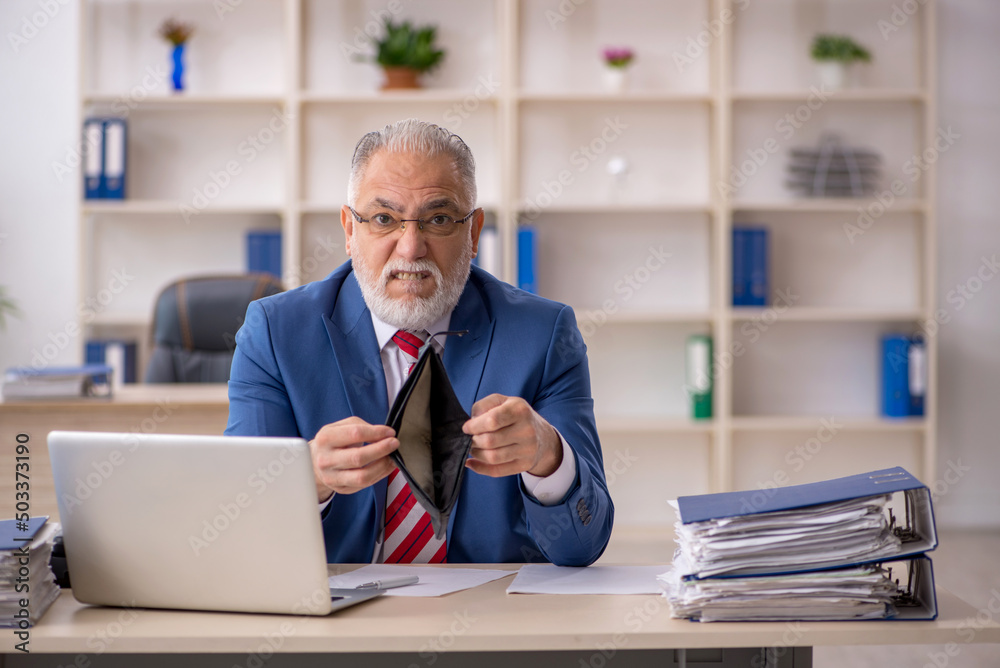 Old male employee in remuneration concept Old male employee in remuneration concept