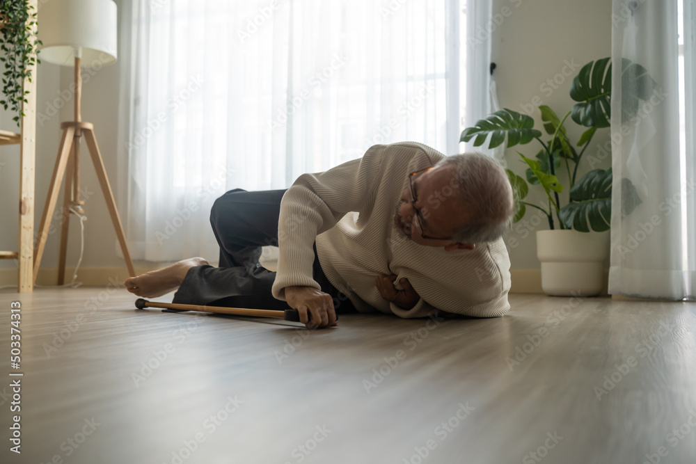 Asian senior male falling on the ground while walk with walker at home. Asian senior male falling on the ground while walk with walker at home.