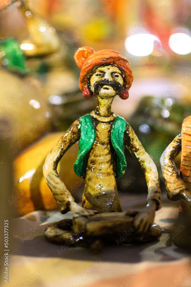 Fototapeta premium KOLKATA, WEST BENGAL , INDIA - NOVEMBER 23RD 2014 : Terracotta doll, artwork of handicraft, on display during Handicraft Fair in Kolkata - the biggest handicrafts fair in Asia.
