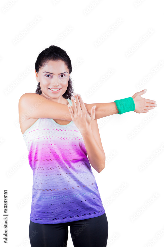 Curly hair woman stretching her arms on studio Curly hair woman stretching her arms on studio