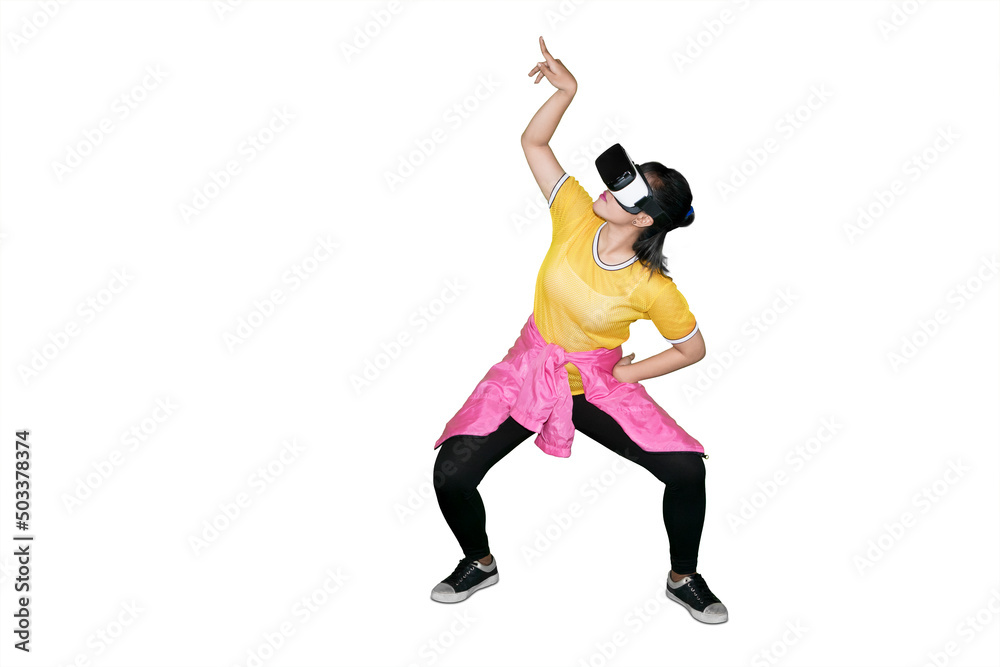 Female dancer wearing VR goggles on studio Female dancer wearing VR goggles on studio