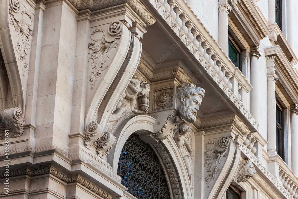 The facade of a building in the historic center of Trieste, Italy.
