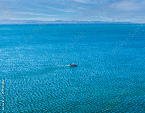 The yacht is on the emerald Adriatic Sea near Duino, Gulf of Trieste, Italy.Breeze