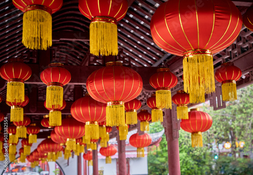 Red lanterns hanging in a park corridor in China