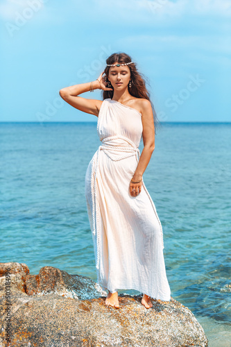 beautiful young stylish woman on the beach