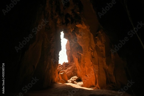 Light shines through the entrance of a cave