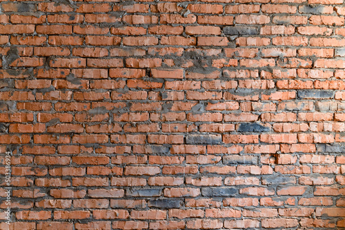 Wallpaper from a brick wall. Full screen red brick wall. Construction background
