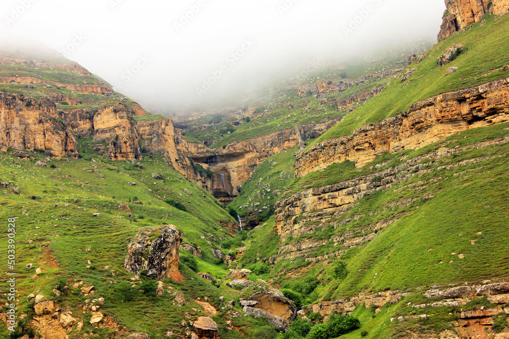 Obraz premium Beautiful waterfall in the red mountains. Gryz village. Guba region. Azerbaijan.