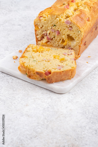 Savory ham and cheese loaf on cutting board