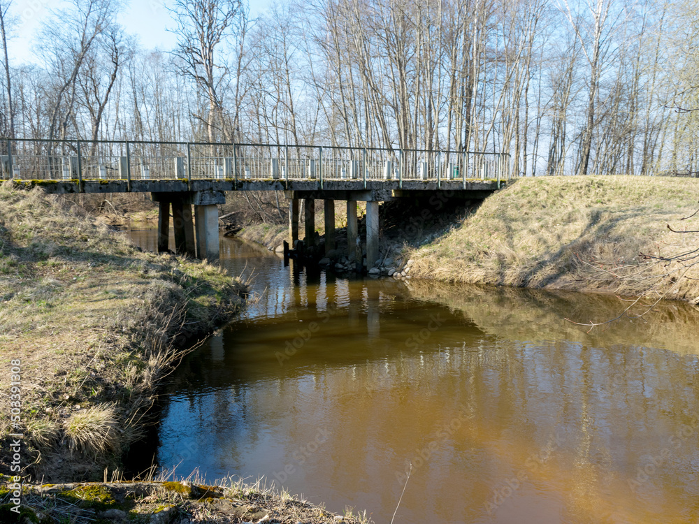concrete bridge over the river of Kuja, a sunny day in early spring with clear blue skies
