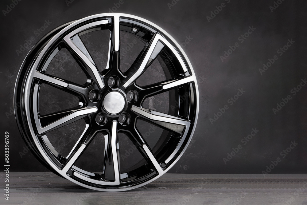 Obraz premium alloy wheels auto parts on a black background copy space